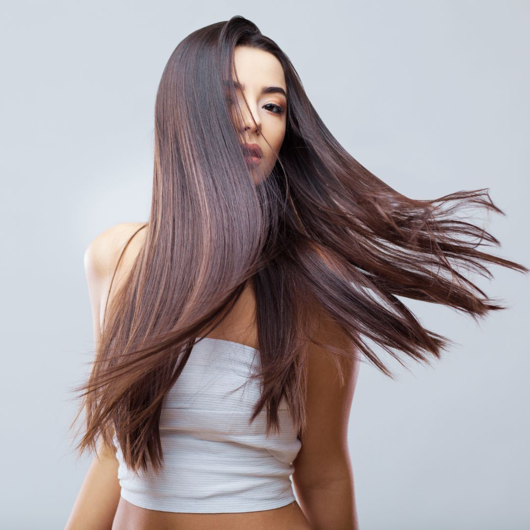 Woman with brazilian blowout straight hair flipping 